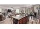 Open floor plan shows kitchen island with seating as well as living and dining areas at 6313 Voss St, North Las Vegas, NV 89081