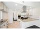 Renovated kitchen with stainless appliances, granite counters, and a gas cooktop on the island at 6330 Spring Meadow Dr, Las Vegas, NV 89103