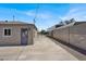The backyard has detached garages and is surrounded by walls at 636 Burton St, Henderson, NV 89015