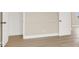 Bedroom featuring laminate flooring, neutral walls, and white doors and trim at 636 Burton St, Henderson, NV 89015