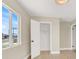 Bright bedroom features wood-look flooring, closet, and a large window at 636 Burton St, Henderson, NV 89015