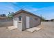 Detached garage with two entryways surrounded by concrete and dirt at 636 Burton St, Henderson, NV 89015