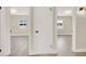 Hallway with doors leading to bedrooms, laminate flooring, and neutral paint at 636 Burton St, Henderson, NV 89015