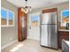 Eat-in kitchen features stainless steel appliances, wood cabinets, and chandelier at 636 Burton St, Henderson, NV 89015
