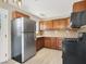 Modern eat-in kitchen with stainless steel appliances and ample cabinet space at 636 Burton St, Henderson, NV 89015