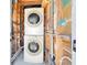 Stackable laundry units surrounded by pipes and open walls at 636 Burton St, Henderson, NV 89015
