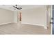 Spacious, light-filled living room featuring hardwood floors and a modern ceiling fan at 636 Burton St, Henderson, NV 89015