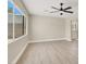 Open-concept living room with large windows and modern ceiling fan at 636 Burton St, Henderson, NV 89015