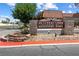 Cimarron West neighborhood sign with well-maintained landscaping and a clear street view on a sunny day at 6442 Ironbark Ln, Las Vegas, NV 89107