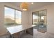 Bright dining area with large windows and sliding glass doors to the backyard at 6486 Vanhoven Crest St, Las Vegas, NV 89166