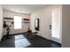 Well-equipped home gym with rubber flooring, weights, stationary bike, and mirrored workout screen at 6486 Vanhoven Crest St, Las Vegas, NV 89166