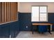Office featuring wainscoting and a desk with a view of the backyard at 6486 Vanhoven Crest St, Las Vegas, NV 89166