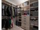 Spacious walk-in closet with custom shelving, hanging rods, and plenty of room for storage at 6486 Vanhoven Crest St, Las Vegas, NV 89166