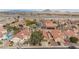 An aerial view of a suburban neighborhood featuring single-Gathering homes and desert landscape at 672 Hitchen Post Dr, Henderson, NV 89011