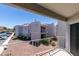 Private balcony with exterior view of nearby buildings and landscaping at 6800 E Lake Mead Blvd # 2072, Las Vegas, NV 89156