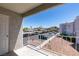 Private balcony offering views of the surrounding neighborhood and parking area at 6800 E Lake Mead Blvd # 2072, Las Vegas, NV 89156