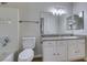 Bright bathroom featuring a granite countertop, white cabinets, and tub-shower combo at 6800 E Lake Mead Blvd # 2072, Las Vegas, NV 89156