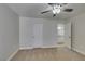 Neutral-toned bedroom with ceiling fan, plush carpet, and ensuite access at 6800 E Lake Mead Blvd # 2072, Las Vegas, NV 89156