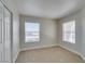 Bright bedroom with plush carpet, natural light from two windows, and ample closet space creating a serene atmosphere at 6800 E Lake Mead Blvd # 2072, Las Vegas, NV 89156