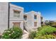 Charming condo featuring stucco exterior, white stairs, and well-maintained landscaping in a desirable location at 6800 E Lake Mead Blvd # 2072, Las Vegas, NV 89156