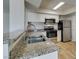 Updated kitchen with stainless steel appliances and granite countertops at 6800 E Lake Mead Blvd # 2072, Las Vegas, NV 89156