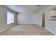 Inviting living room with soft carpet, neutral walls, and a window for natural light at 6800 E Lake Mead Blvd # 2072, Las Vegas, NV 89156