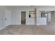 Spacious living room with soft carpet and views of kitchen and bathroom at 6800 E Lake Mead Blvd # 2072, Las Vegas, NV 89156