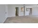 Spacious living room with soft carpet and views of kitchen and bathroom at 6800 E Lake Mead Blvd # 2072, Las Vegas, NV 89156