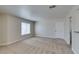 Inviting living room with soft carpet, neutral walls, and a window for natural light at 6800 E Lake Mead Blvd # 2072, Las Vegas, NV 89156