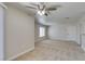 Spacious living room with carpet, a modern ceiling fan, natural light, and neutral walls creates a welcoming atmosphere at 6800 E Lake Mead Blvd # 2072, Las Vegas, NV 89156