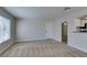 Inviting living room with soft carpet, neutral walls, and a window for natural light at 6800 E Lake Mead Blvd # 2072, Las Vegas, NV 89156