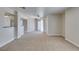 Bright living room with soft carpet, ceiling fan, and sliding glass door to balcony at 6800 E Lake Mead Blvd # 2072, Las Vegas, NV 89156