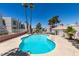 Community pool area with lounge chairs and manicured landscaping at 6800 E Lake Mead Blvd # 2072, Las Vegas, NV 89156