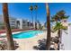 Inviting community pool area surrounded by palm trees and lounge chairs at 6800 E Lake Mead Blvd # 2072, Las Vegas, NV 89156