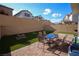 Spacious backyard with a brick patio, fire pit, and ample space for outdoor activities at 7037 Tilligerry St, North Las Vegas, NV 89084