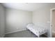 Neat bedroom featuring neutral walls, carpet, twin bed, and ample space with natural lighting at 7037 Tilligerry St, North Las Vegas, NV 89084