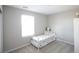 Cozy bedroom featuring a twin bed, white furniture and neutral walls with soft, natural lighting at 7037 Tilligerry St, North Las Vegas, NV 89084