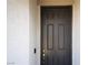 Stylish front door featuring a modern design, enhancing the home's curb appeal and security at 7037 Tilligerry St, North Las Vegas, NV 89084