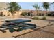 Inviting picnic area with tables, benches, mature landscaping, and ample space for outdoor activities and community gatherings at 7037 Tilligerry St, North Las Vegas, NV 89084