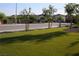 Well-kept street with lush green grass provides a welcoming atmosphere in this charming community at 7037 Tilligerry St, North Las Vegas, NV 89084