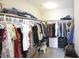 Spacious walk-in closet with ample hanging space, shelving and storage for optimal organization at 7037 Tilligerry St, North Las Vegas, NV 89084