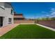 Spacious backyard featuring well-maintained lawn and privacy fence at 7124 Sayonara Vista St, North Las Vegas, NV 89084
