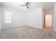 Neutral bedroom with carpet, ceiling fan, and natural light at 7124 Sayonara Vista St, North Las Vegas, NV 89084