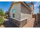 Exterior facade showcasing the stone accents, brick paver walkway, and stucco exterior of the home at 7124 Sayonara Vista St, North Las Vegas, NV 89084