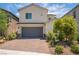 Charming two-story home with a two car garage and beautifully landscaped front yard with desert landscaping at 7124 Sayonara Vista St, North Las Vegas, NV 89084