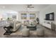 Stylized living room featuring modern furnishings, neutral tones, and abundant natural light at 7124 Sayonara Vista St, North Las Vegas, NV 89084