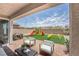 Outdoor patio with seating, dining, and playground at 7124 Sayonara Vista St, North Las Vegas, NV 89084