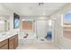 Bright bathroom with a soaking tub, a separate shower, and a double vanity at 7502 Lush Oasis Ave, Las Vegas, NV 89113