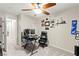 Functional bedroom featuring a ceiling fan, comfortable space, and convenient access to adjacent rooms and amenities at 7502 Lush Oasis Ave, Las Vegas, NV 89113