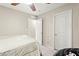 This bedroom contains an additional closet space, a ceiling fan and neutral tones at 7502 Lush Oasis Ave, Las Vegas, NV 89113